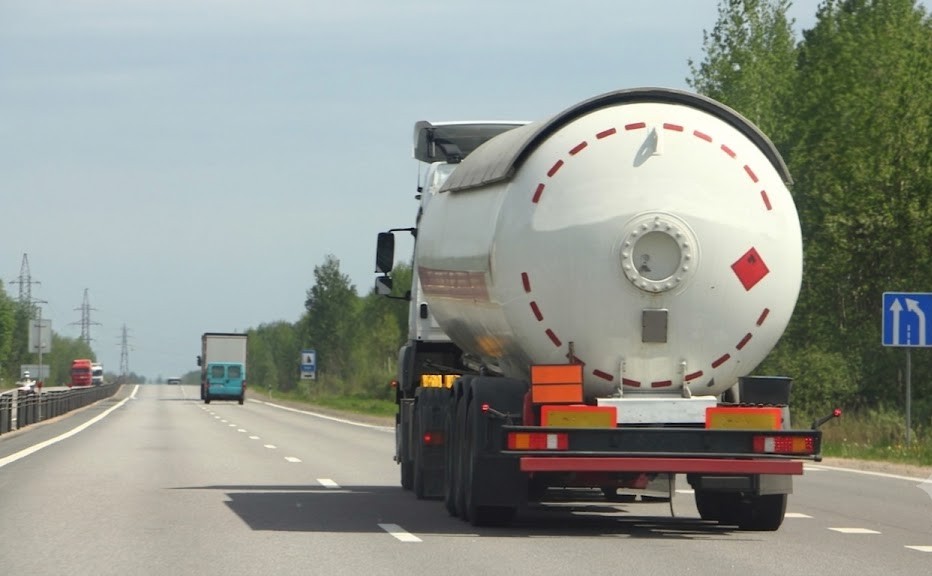 A truck displaying hazardous-goods markings