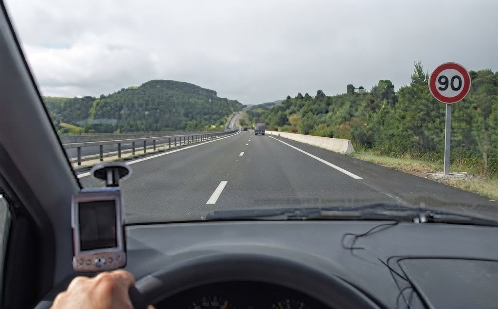 Question image: A driver is travelling at 100 km/h on a road where the maximum permitted speed i