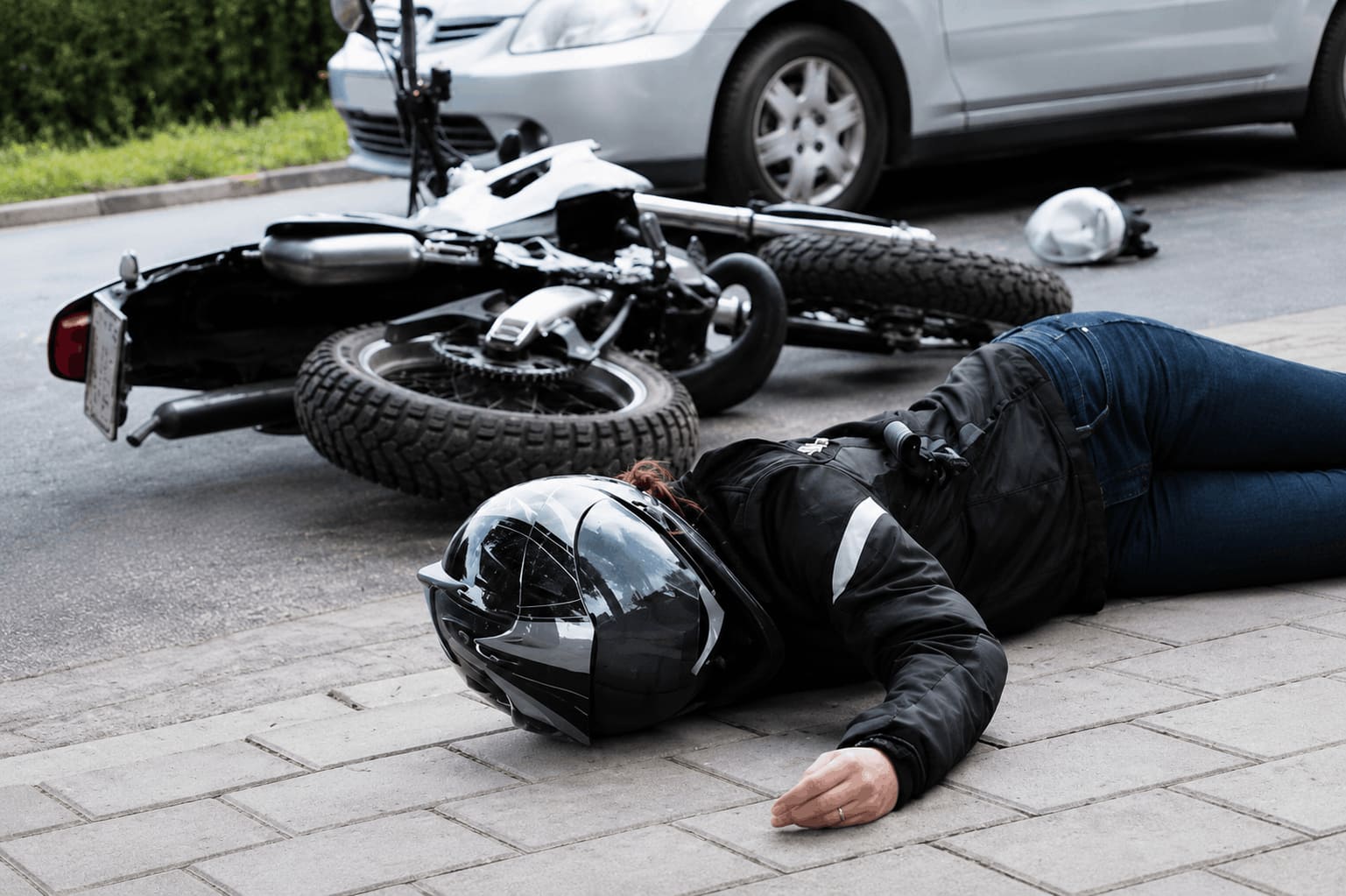 Question image: At an accident scene, you find an unconscious motorcyclist still wearing a helme