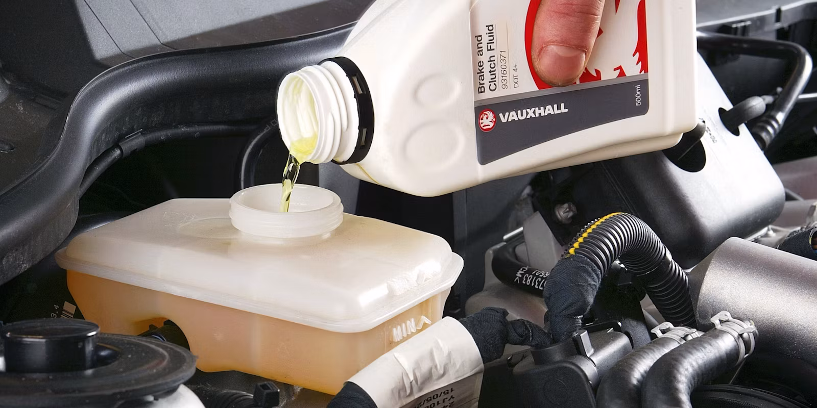Question image: The brake fluid in the reservoir is dark and dirty-looking. What does this mean?
