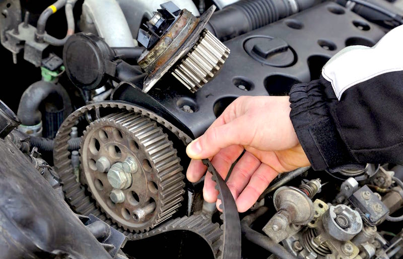 Question image: What should you look for when inspecting the vehicle's belts and hoses?