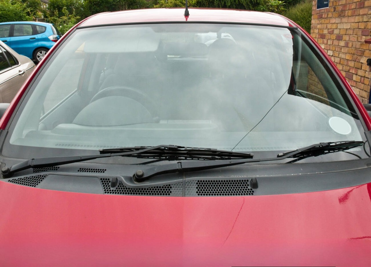 Question image: The wipers work but no fluid comes out of the nozzles. What should you check?