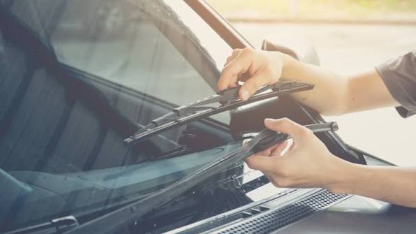 Question image: The wiper blades streak and squeak. What should you do?