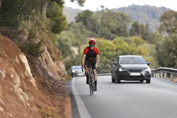 Question image: A driver must not overtake a cyclist when: