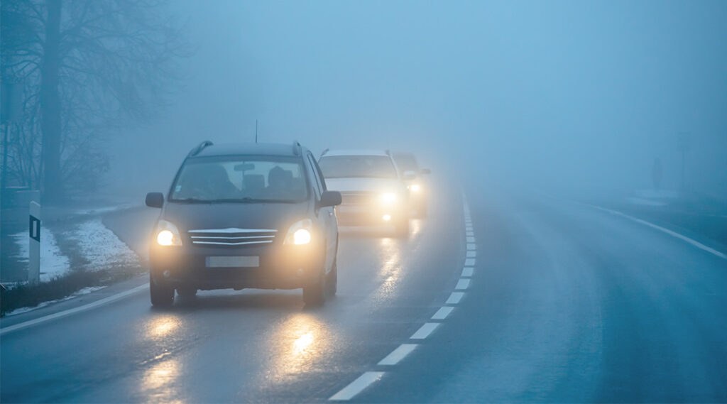 Question image: In reduced-visibility conditions, what should the safety distance to the vehicle