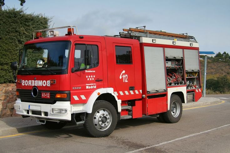 Question image: When an emergency vehicle approaches with siren and lights, how should the drive