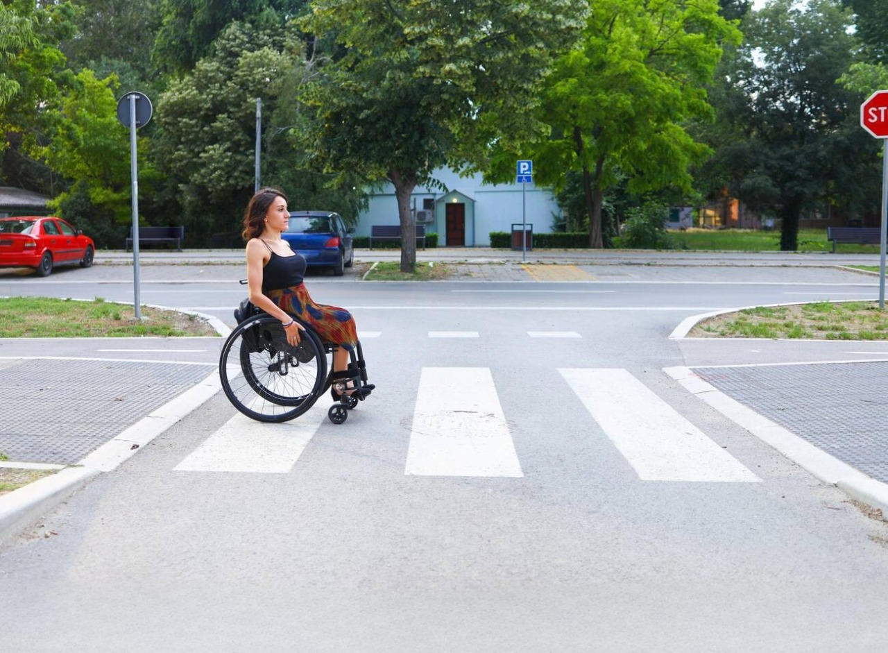 Question image: When a wheelchair user is crossing at a pedestrian crossing, the driver must: