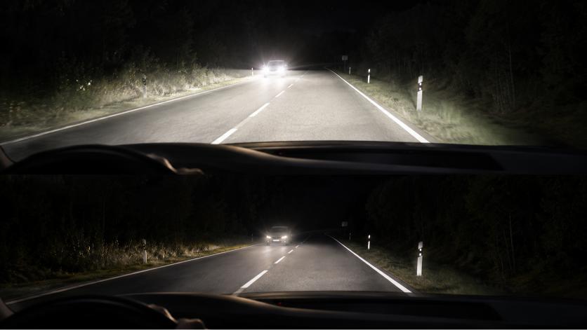 Question image: You are driving at night on an unlit road with main beam on and a vehicle approa
