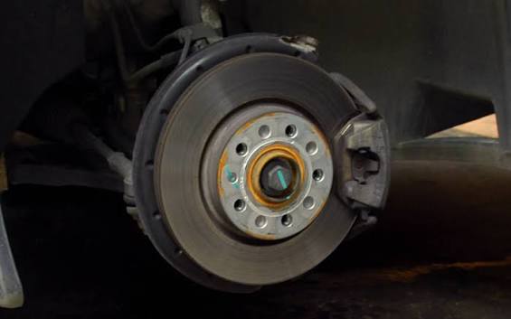 Question image: When braking, you hear a squeak and notice reduced brake response. What is this