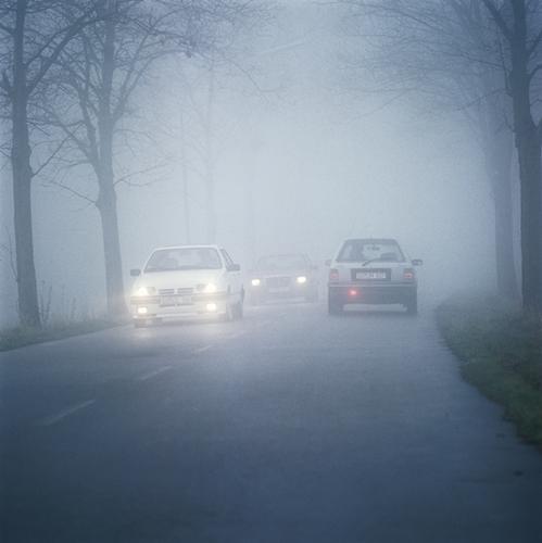 Question image: If you need to stop in the middle of dense fog, what is the correct action?