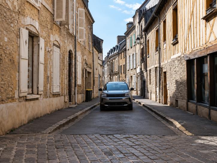 Question image: On a narrow road where both vehicles enter at the same time, who has priority?